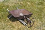 old-fashioned-wheelbarrow-broken-31769789.jpg